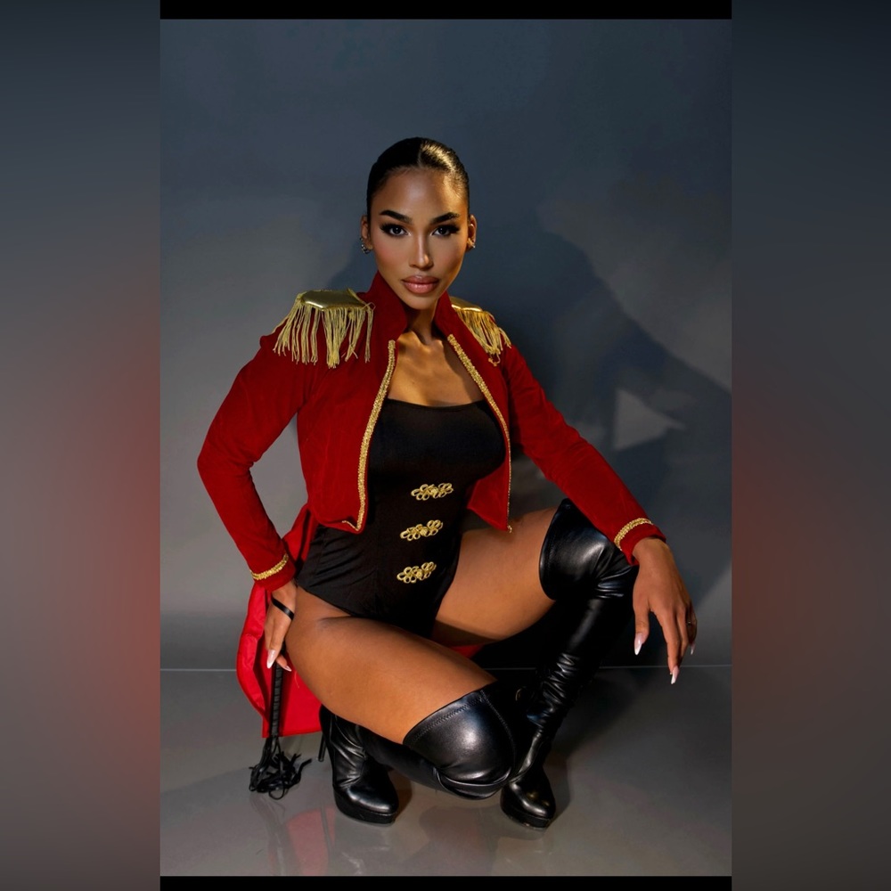 Ringleader costume includes jacket, bodysuit, whip, and hat